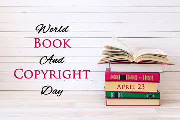 World book and copyright day, april 23. Poster with stack of books.