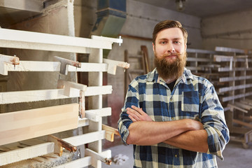Hipster carpenter with crossed arms - obrazy, fototapety, plakaty