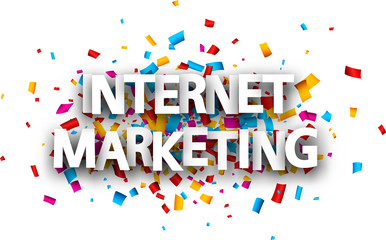 Big white internet marketing sign over confetti background.
