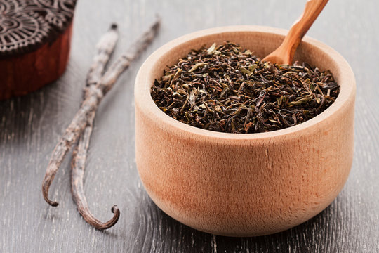 black tea with vanilla on a dark background