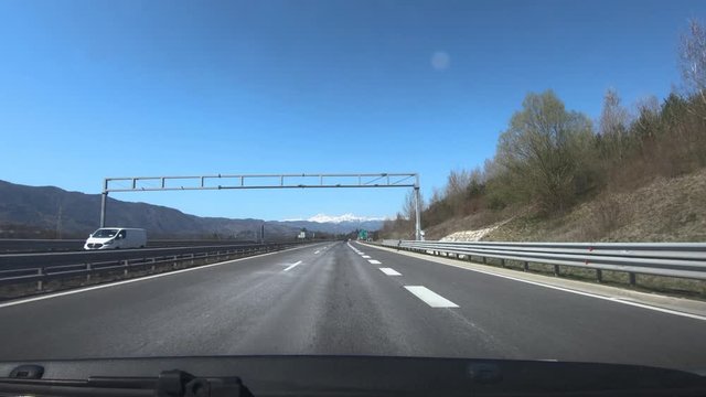 Time lapse speed up POV Point of view driving on almost empty highway road in Slovenia on workday. Coronavirus Covid-19 lockdown quarantine