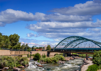 Fototapeta premium The Platte river running under a bridge in Confluence Park in Denver, Colorado