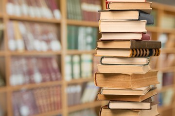 Collection stack of old retro books on the library background