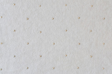 Beige knitted woolen background. Knitwear fabric texture.