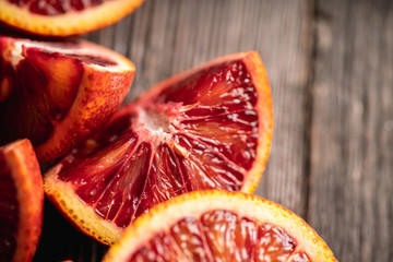 Ripe bloody oranges on the rustic background. Selective focus. Shallow depth of field.

