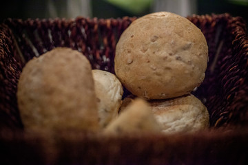  Bunch of sliced French breads and sandwiches in a basket. 