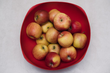 Naklejka na ściany i meble Apples in an Apple basket, apples in a basin