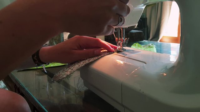 Carefully Stitching Corners Of Self Made Face Mask - close up shot