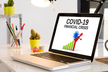 Computer on the desk with Covid-19 crisis info website