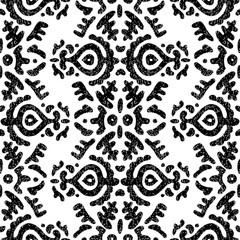 Cute black and white pattern. Ink decorative flowers. Ethnic and tribal motifs. Bohemian print for textiles. Vector illustration.