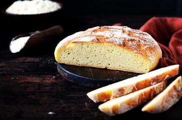Homemade corn bread on a dark wooden table