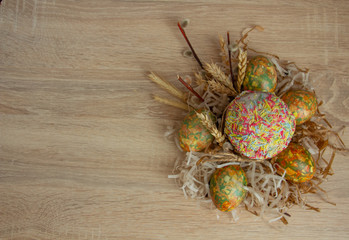 Easter composition of Easter cake and Easter eggs in green shades on the right side of the frame