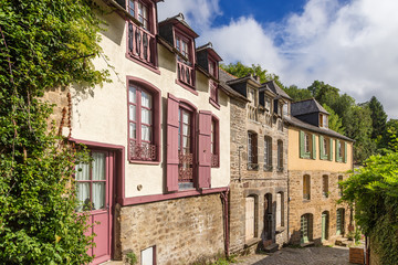 Fototapeta na wymiar Dinan, France. Facades of old buildings on Petit Fort street