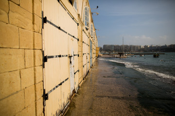 Old yellow fringed doors in Valletta, Malta