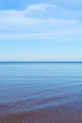 selective focus, smooth horizon line, blue lake