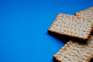 Tradicional Polish biscuits separated with crumbs and blue background