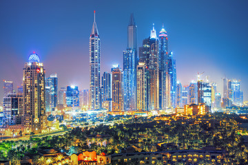 Obraz premium Modern and Luxury Dubai Marina with reflection - famous Jumeirah beach at sunrise, United Arab Emirates