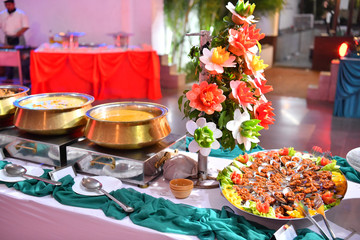 A traditional Indian wedding buffet. Assortment of traditional cuisine at an Asian wedding.
