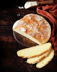 Homemade corn bread on a dark wooden table