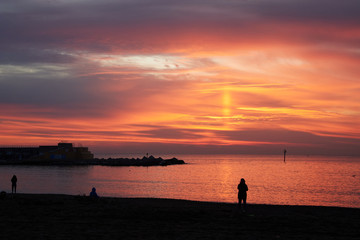 Fototapeta premium Barceloneta beach at sunrise in Barcelona, Spain