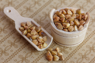 buckwheat in a wooden bowl and scoop
