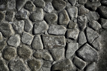 old stone pavement background / abstract pavement, large cobblestones, old road texture