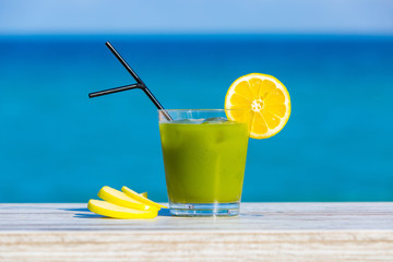 Green Smoothie with sea in background