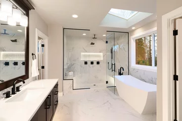 Fotobehang Luxury modern home bathroom interior with dark brown cabinets, white marble, walk in shower, free standing tub. © Iriana Shiyan