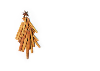 Christmas tree made of cinnamon sticks on a white background