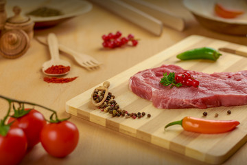 Fototapeta na wymiar raw beef steak with vegetables