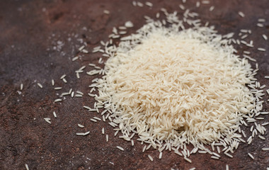 white basmati rice on a brown background