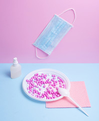 Still life: disposable tableware and items to protect against viruses.