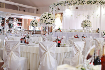 luxury wedding decorations with bench, candle and flowers composition on ceremony place