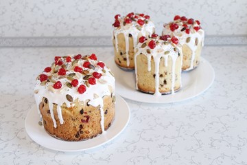 Easter orthodox sweet bread, kulich with berries and pumpkin seeds. Christian holidays concept with copy space