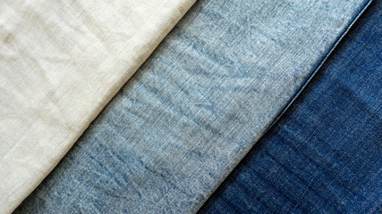Pocket on blue jeans close-up. Textile material texture / macro denim background.
