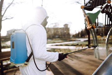 Cleaning and Disinfection the playground with spray chemicals to preventing the spread of the epidemic of coronavirus, pandemic in quarantine city. Covid-19.