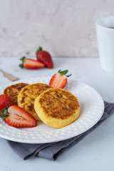 Cheesecakes on a gray background, Russian traditional breakfast
