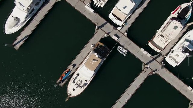 Aerial view of yachts still in docks.