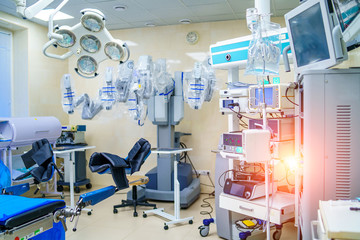 Surgical room in hospital with robotic technology equipment, machine arm surgeon in futuristic operation room. Minimal invasive surgical innovation, medical robot surgery with endoscopy