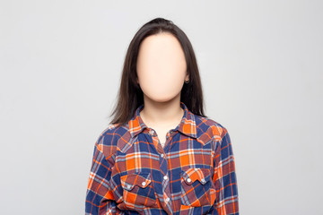 Woman Without a Face. On the walls hang the face masks. Nobody.