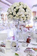 luxury wedding decorations with bench, candle and flowers composition on ceremony place