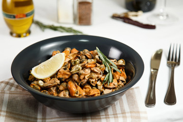 portion of roasted mussels served on table delicious