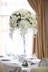 luxury wedding decorations with bench, candle and flowers composition on ceremony place