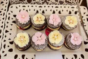 Delicious candy bar with macarons, cucakes and other sweets