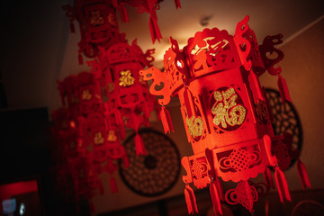 red chinese decorations hanging by ceiling