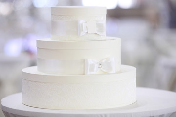 Wedding white cake on light background
