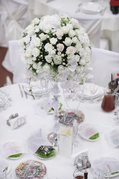 luxury wedding decorations with bench, candle and flowers composition on ceremony place