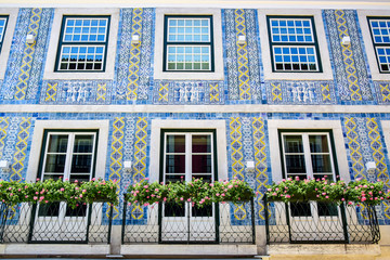 Lisbon, Portugal - 07.23.2019: City house decorated with Portuguese azulejo tiles, blue with white...