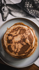 Pancakes with toppings on a table