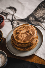 Pancakes with toppings on a table